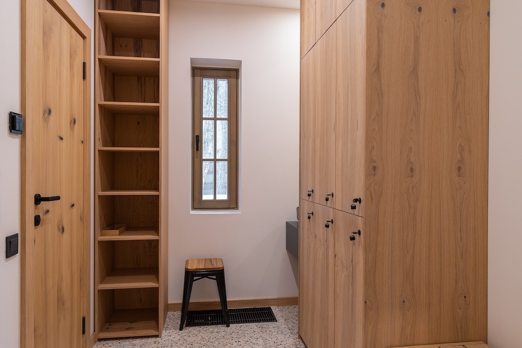 Spa changing room at Chalet Alpino Resort with bespoke timber lockers and shelving