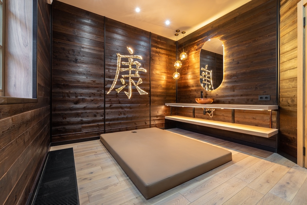 Tatami relaxation room at the SPA in Chalet Alpino Resort featuring timber interiors and meditation platform