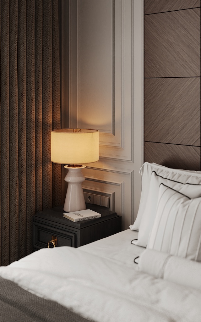 Luxury hotel bedroom interior design by Claire Dominics Buro featuring bespoke bedside table, decorative wall paneling and soft ambient lighting