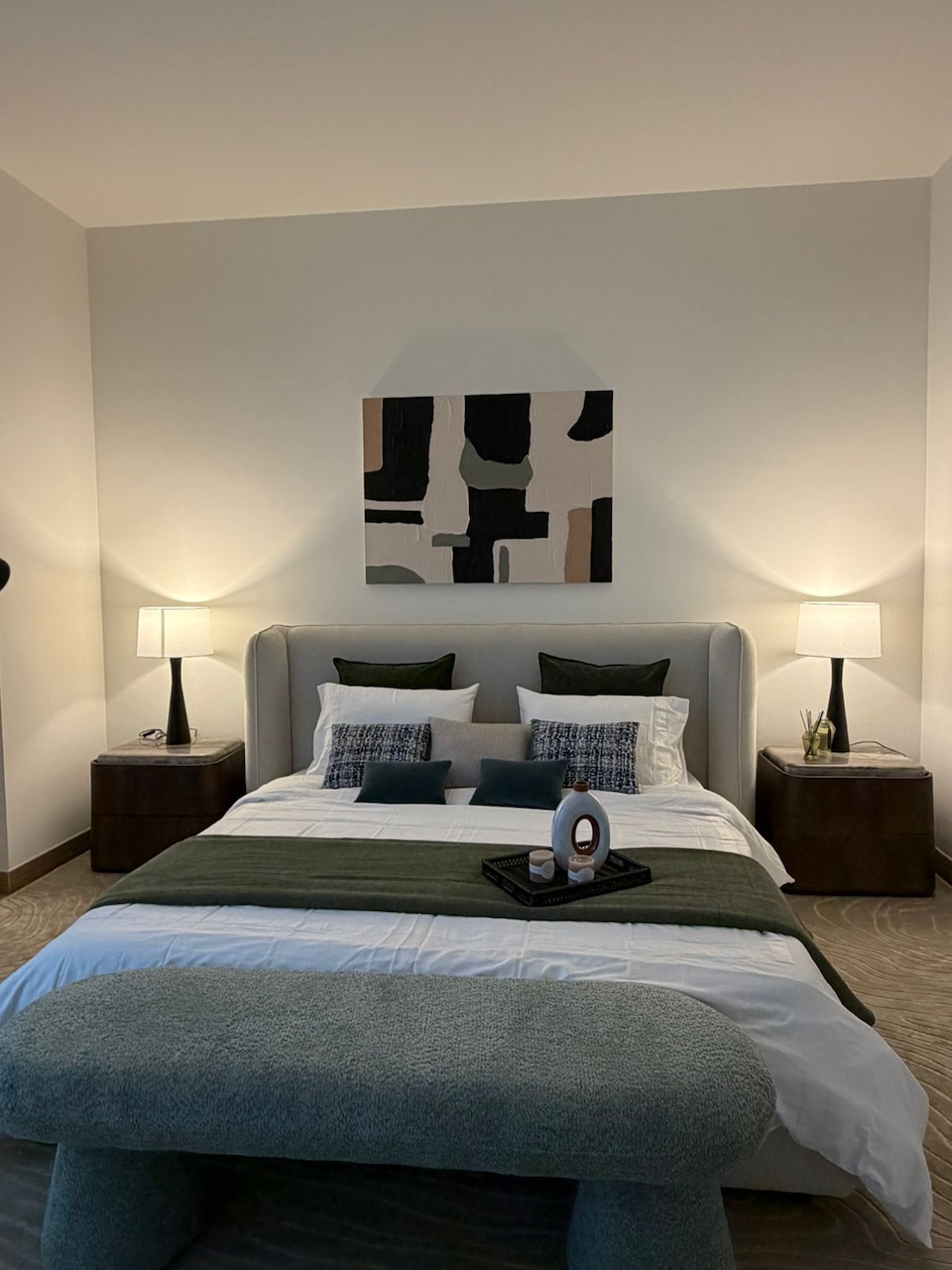 Luxury villa bedroom interior design in Dubai by Claire Dominics Buro featuring bespoke headboard, custom nightstands and layered lighting