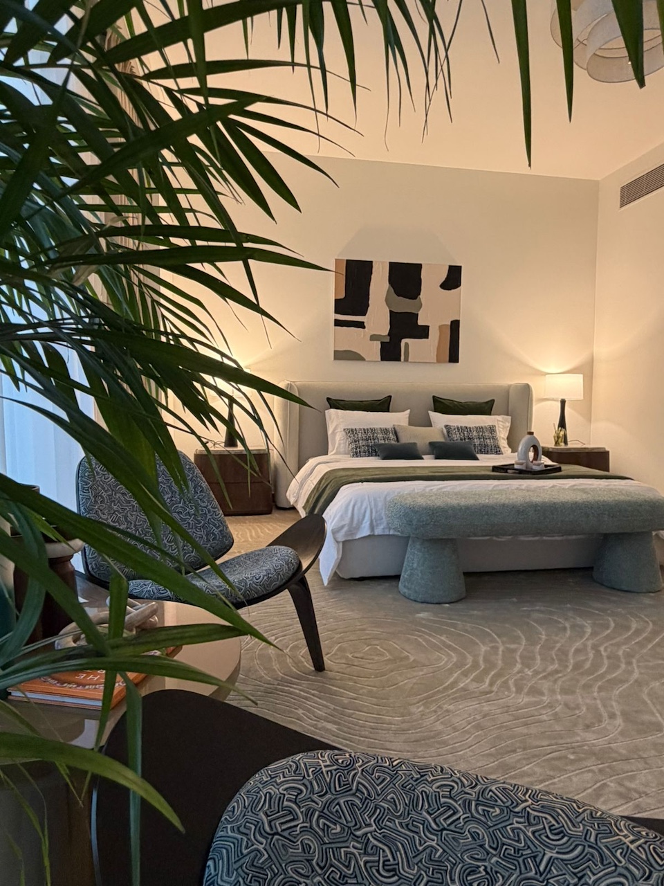 Luxury master bedroom interior design in Dubai by Claire Dominics Buro featuring bespoke furnishing, accent seating and layered lighting