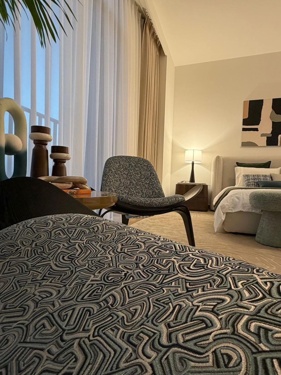 Luxury villa bedroom interior design in Dubai by Claire Dominics Buro featuring bespoke lounge seating and layered textile detailing