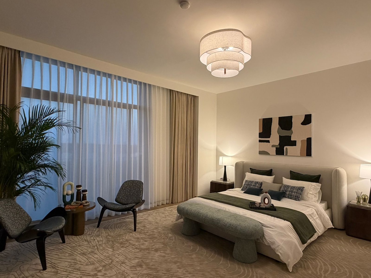 Luxury master bedroom interior design in Dubai by Claire Dominics Buro featuring bespoke furnishing, lounge seating and layered lighting
